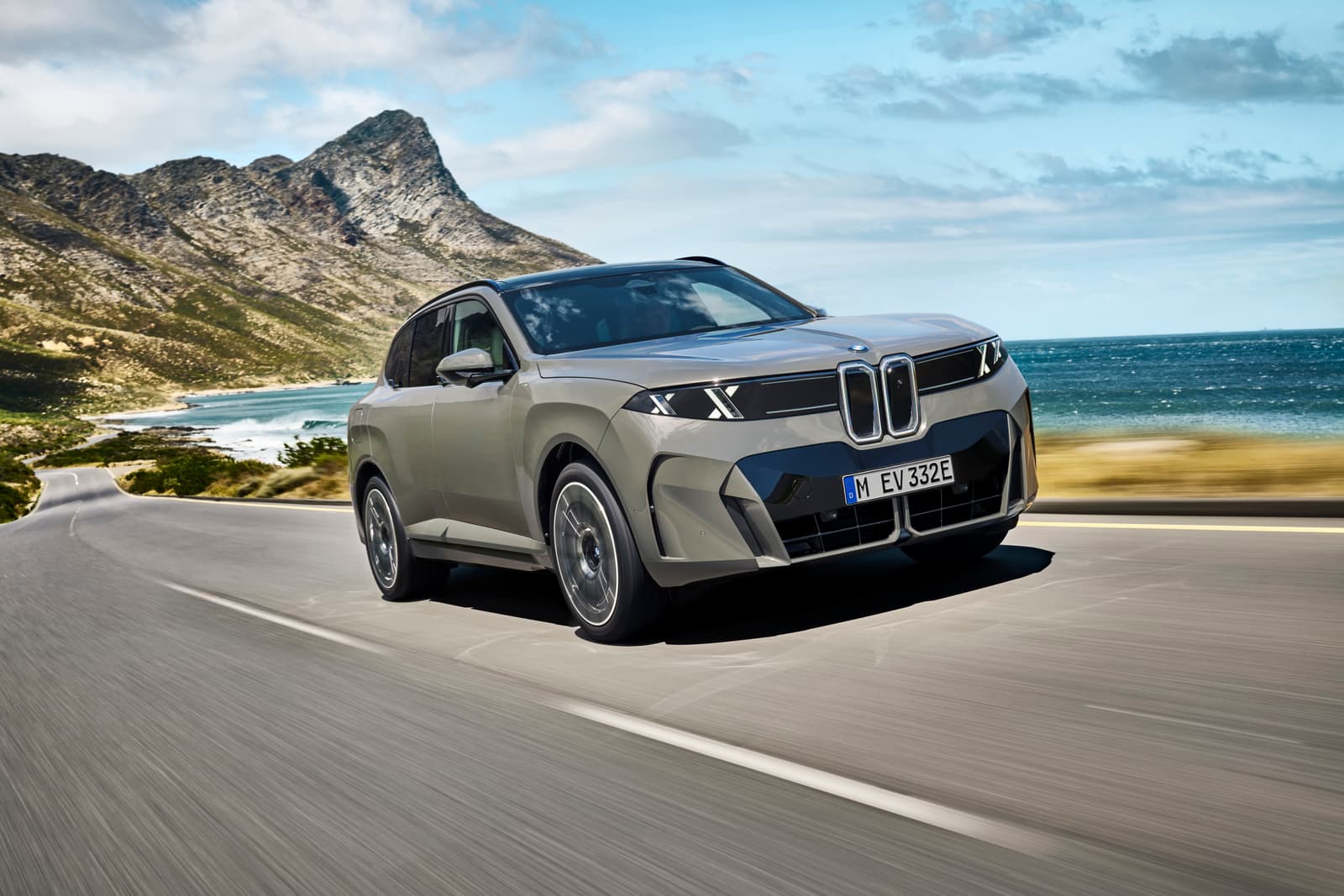 BMW X5 front 3/4 green driving